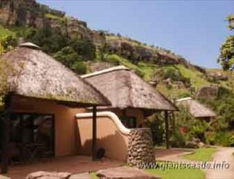 Thatched Chalet: Thatched chalet surrounded by mountain scenery at Didima Camp